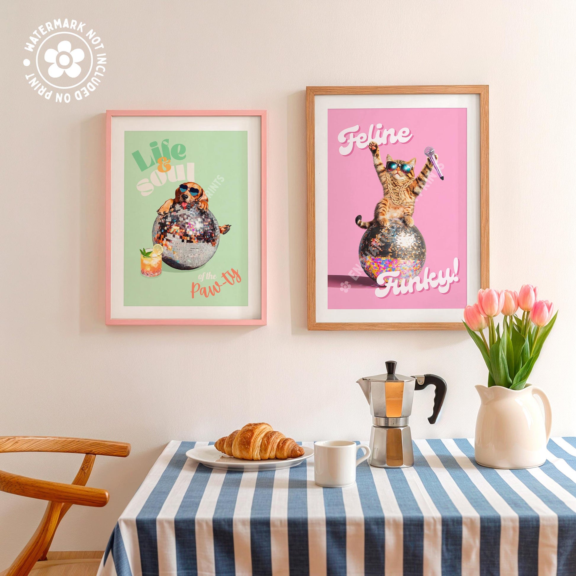 a table topped with a plate of food next to two framed pictures