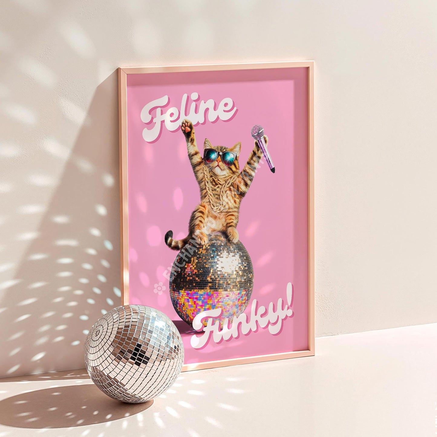 a picture of a cat on a pink background with a disco ball