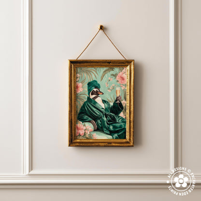 a framed painting of a penguin wearing a green robe and holding a glass of wine, set against a floral background.
