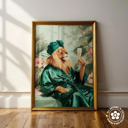 A framed painting depicting a lion wearing a green robe and holding a glass of champagne, surrounded by tropical foliage.
