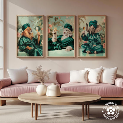 a living room with a pink sofa and a wooden coffee table. Above the sofa, there are three framed paintings depicting animals dressed in green robes, each holding a wine glass.
