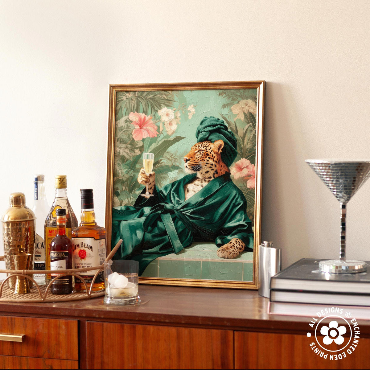 a framed painting of a leopard wearing a green robe and holding a champagne glass, surrounded by various bottles of alcohol and a cocktail shaker on a wooden surface.