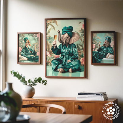 a wooden cabinet with a vase of greenery and a stack of books on top. Above the cabinet, there are three framed paintings depicting elephants in various poses and outfits.