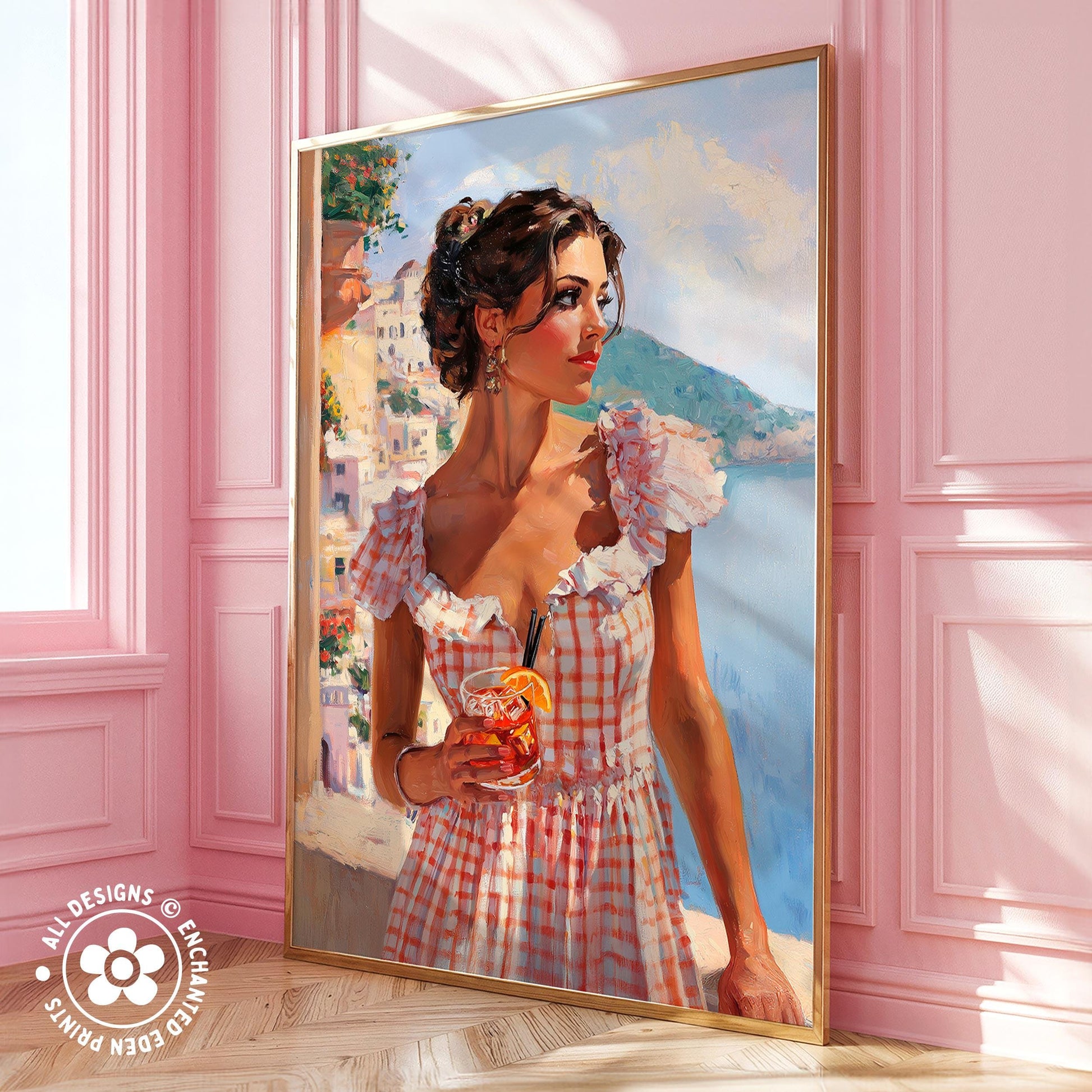 A woman in a pink and white checkered dress holding a drink stands in front of a painting of a coastal town.
