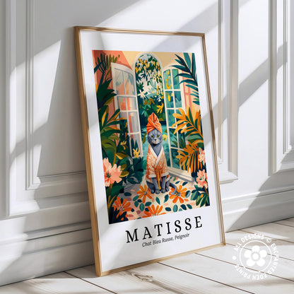 The image is a framed poster featuring an illustration of a cat wearing a towel and sitting on a windowsill, surrounded by tropical foliage.