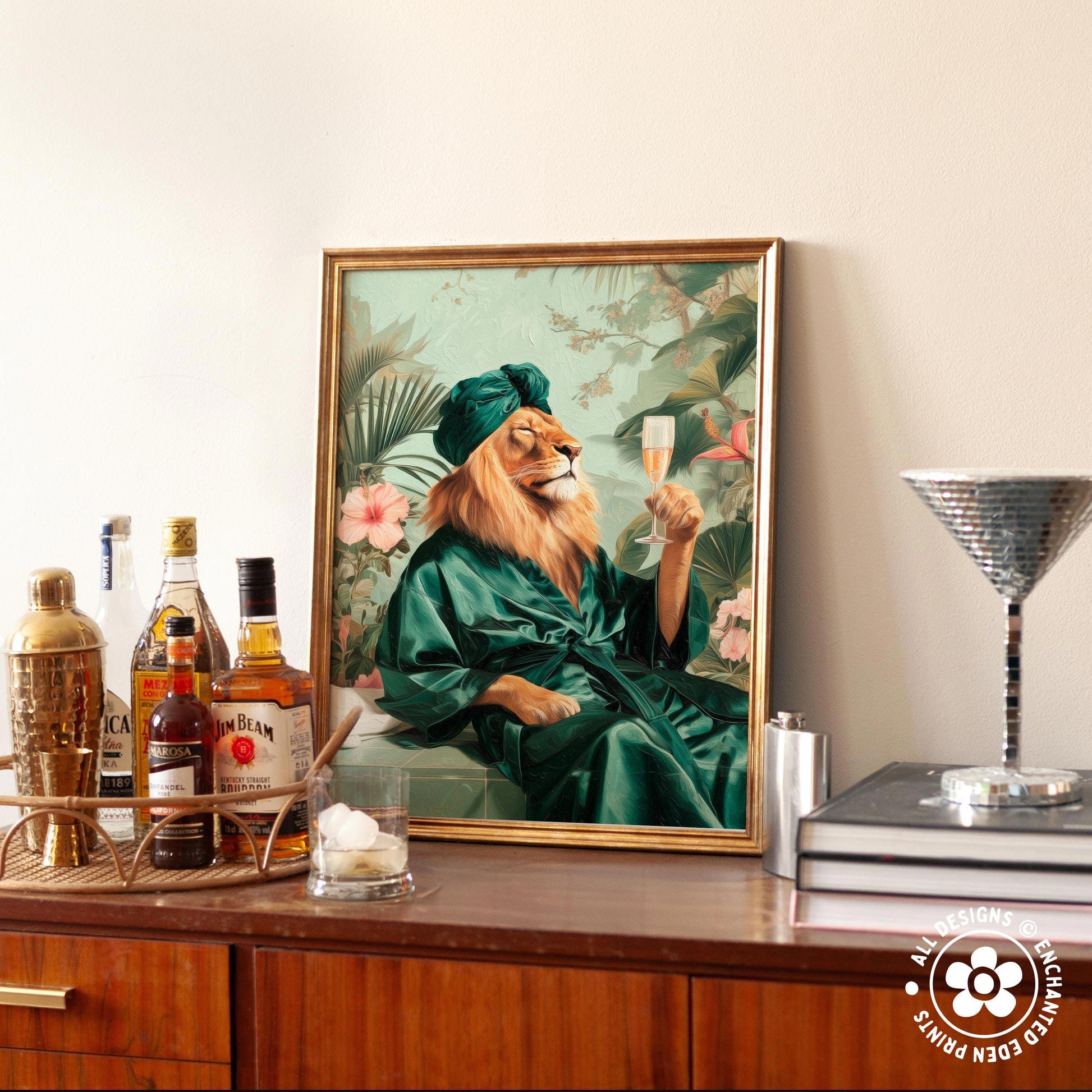 a framed painting of a lion wearing a green robe and holding a glass of champagne, surrounded by various bottles of alcohol and a cocktail shaker on a wooden surface.