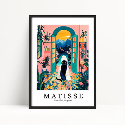 The image is a framed poster featuring a colorful illustration of a cat sitting in a garden with a pink wall, green archway, and a view of mountains in the background.