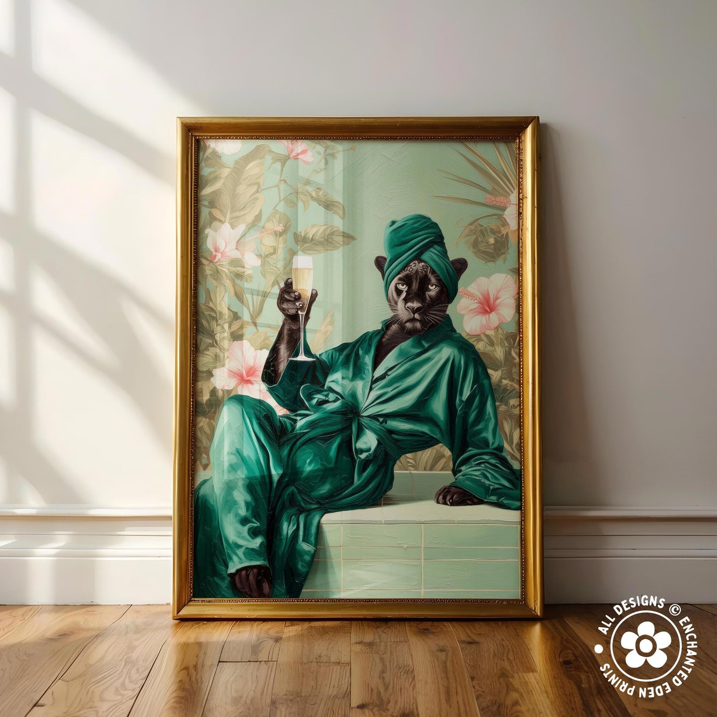 A framed painting depicting a black cat wearing a green robe and holding a glass of wine, sitting on a ledge against a floral background.