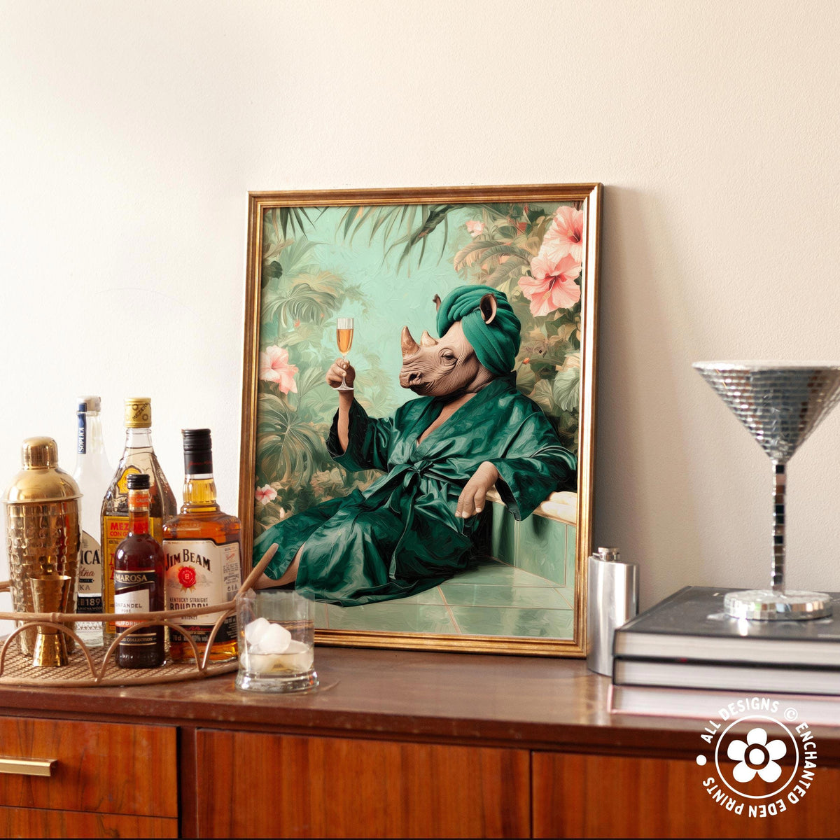 a framed painting of a rhinoceros wearing a green bathrobe and holding a glass of wine, surrounded by various bottles of alcohol and a cocktail shaker on a wooden surface.