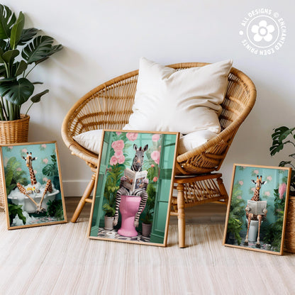 three framed artworks depicting giraffes in various whimsical and humorous situations, such as sitting on a toilet, reading a book, and relaxing in a bathtub.
