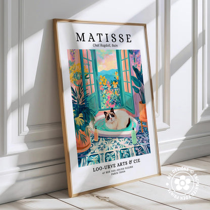 The image is a framed poster featuring an illustration of a cat sitting in a colorful, tropical-style room with a window and plants.