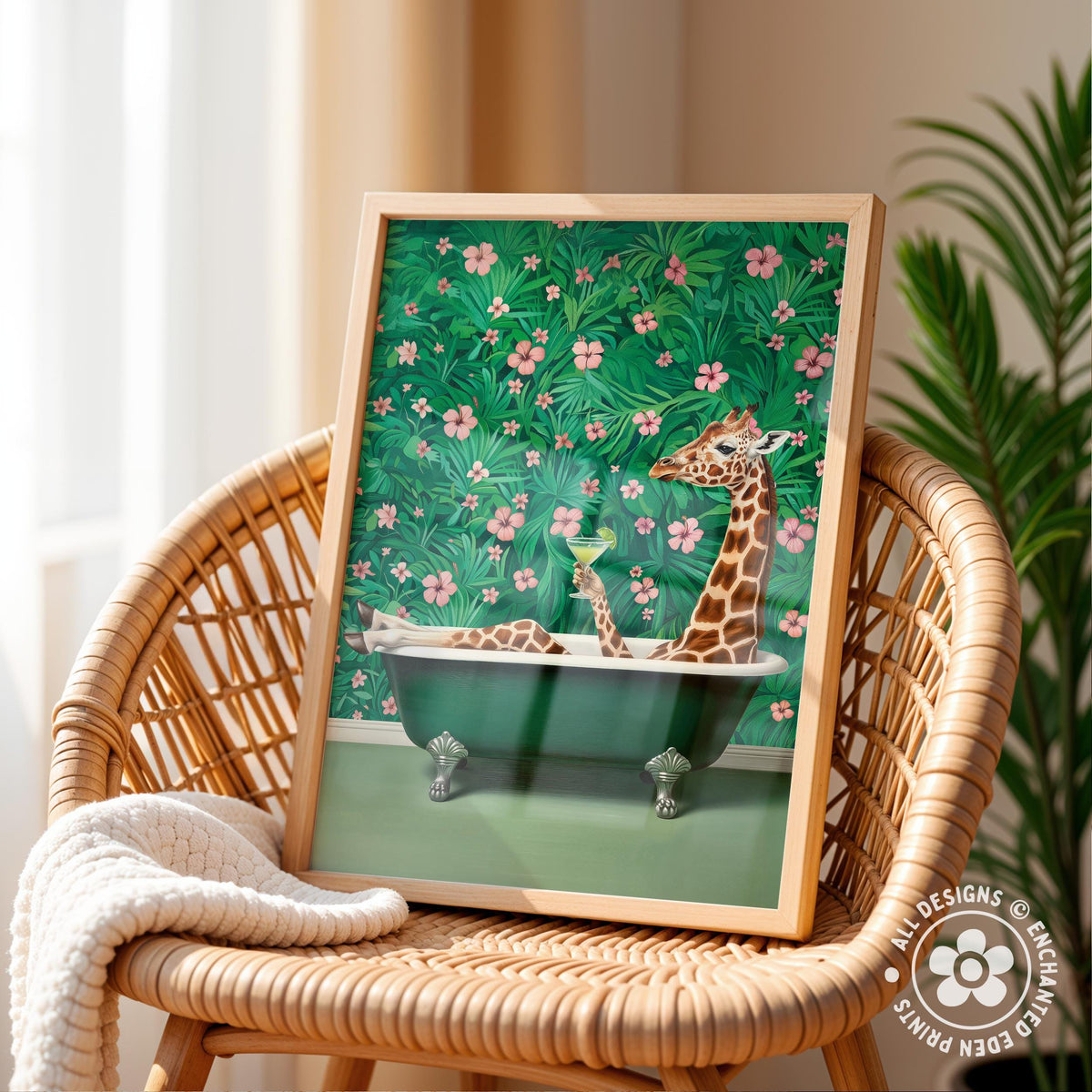 A framed illustration of a giraffe sitting in a bathtub filled with flowers, surrounded by a lush green background.