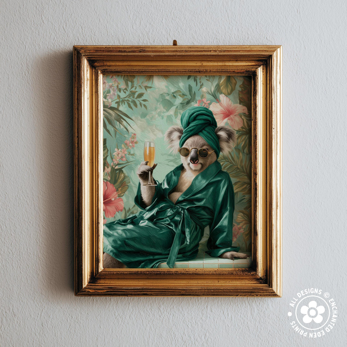 A framed image of a koala wearing a green robe and holding a glass of champagne, set against a floral background.