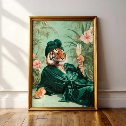 A framed painting depicting a tiger wearing a green robe and holding a glass of champagne, surrounded by tropical foliage and flowers.