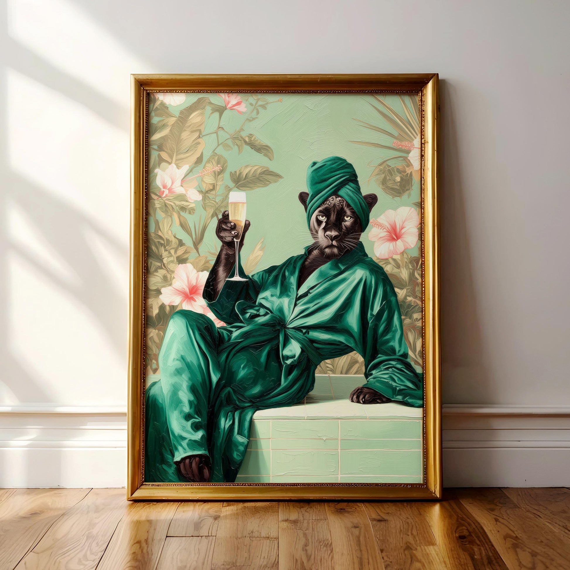 A framed painting depicting a cat wearing a green bathrobe and holding a glass of champagne, with a tropical floral background.