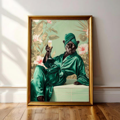 A framed painting depicting a cat wearing a green bathrobe and holding a glass of champagne, with a tropical floral background.