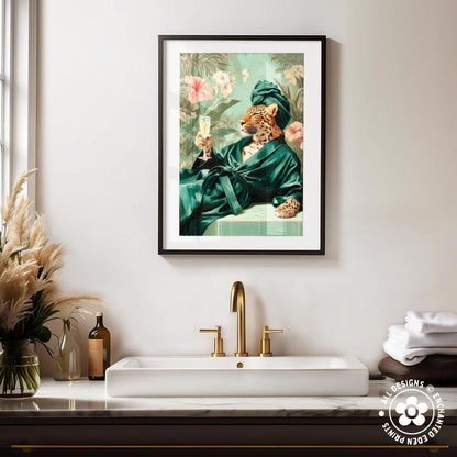 a framed painting of a leopard wearing a green robe and holding a champagne glass, set against a tropical background.