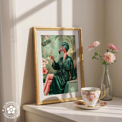 a framed painting of a woman in a green bathrobe holding a glass of wine, surrounded by pink flowers and a vase of pink flowers on a white shelf.