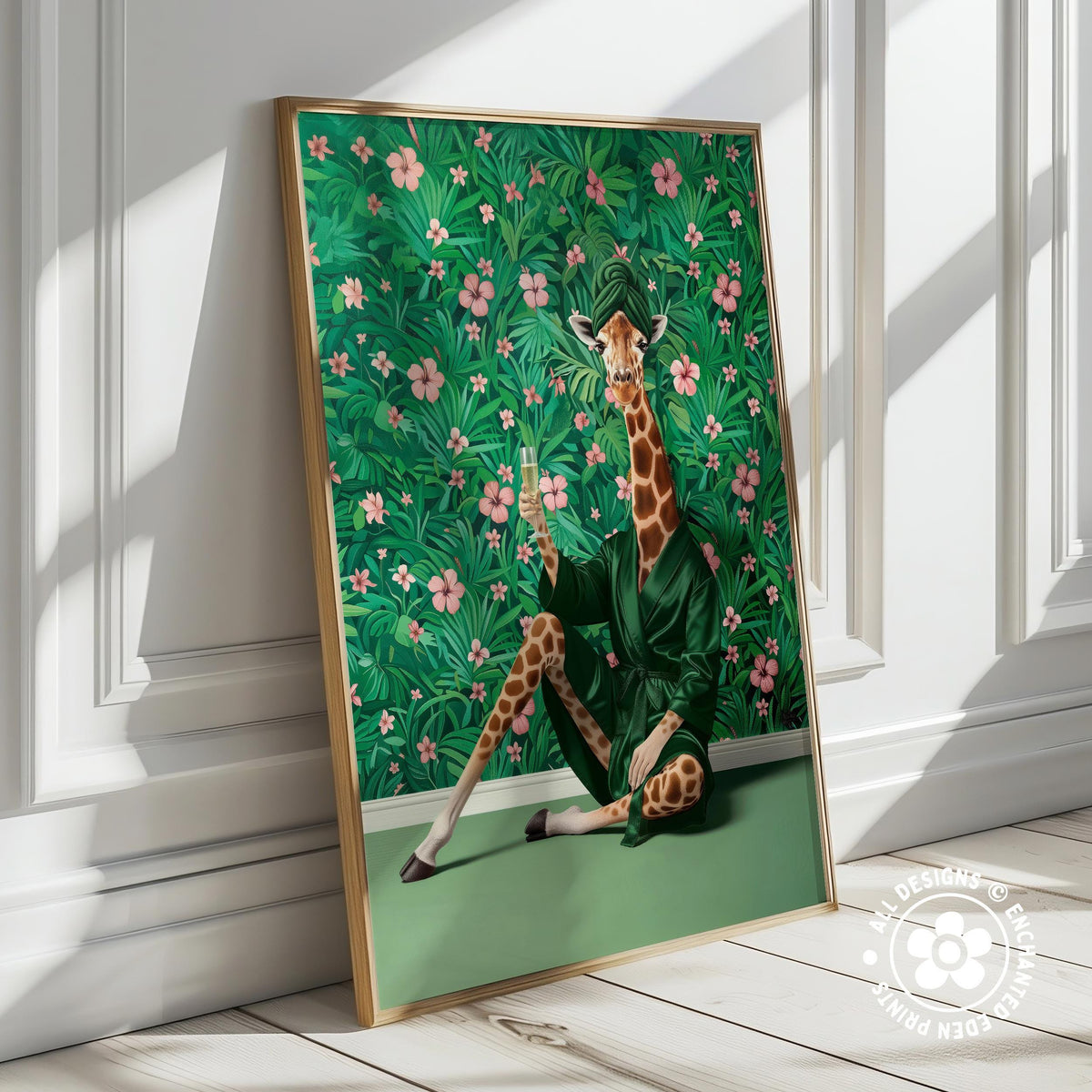 A giraffe wearing a green robe is sitting on a green surface, surrounded by a lush green background with pink flowers.