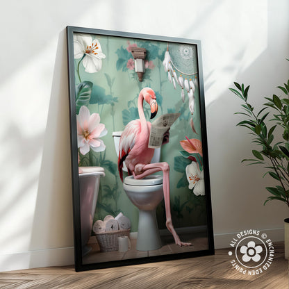 A framed illustration depicting a pink flamingo sitting on a toilet and reading a newspaper, surrounded by flowers and a dreamcatcher.