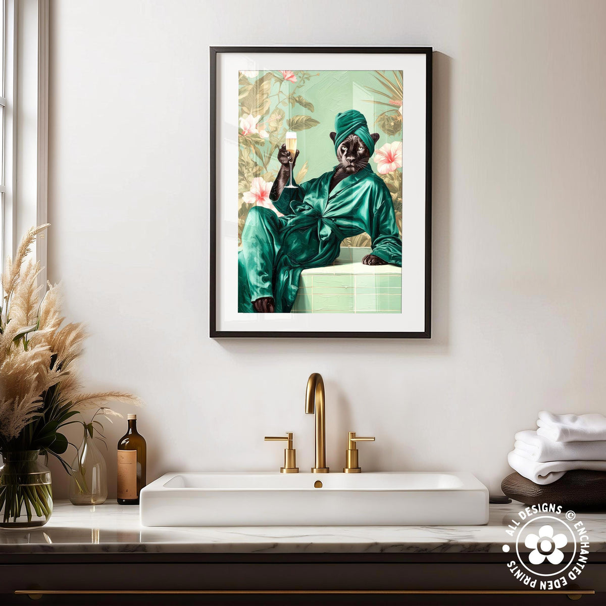 a framed painting of a person in a green robe sitting on a white countertop, holding a glass of wine.