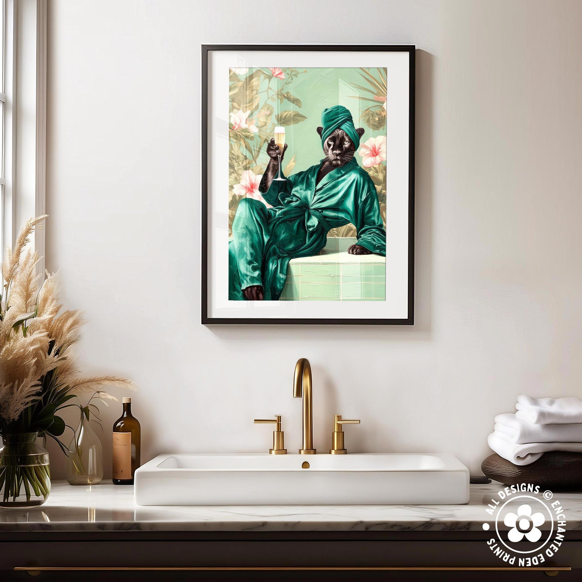 a framed painting of a person in a green robe sitting on a white countertop, holding a glass of wine.
