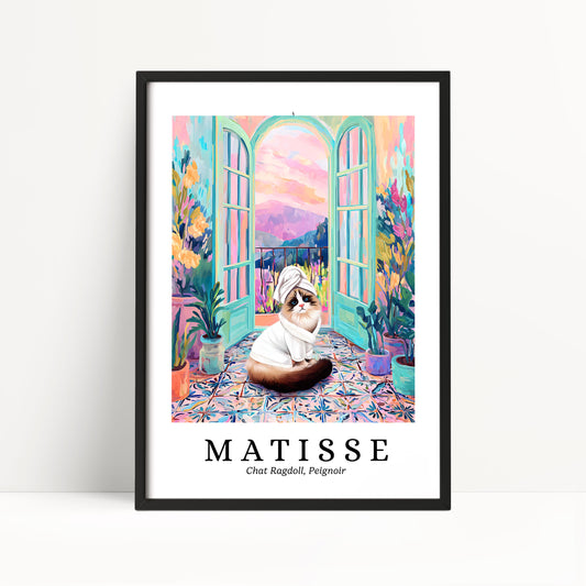 A framed poster featuring a cat sitting on a colorful, patterned floor in front of a window with a view of a garden.
