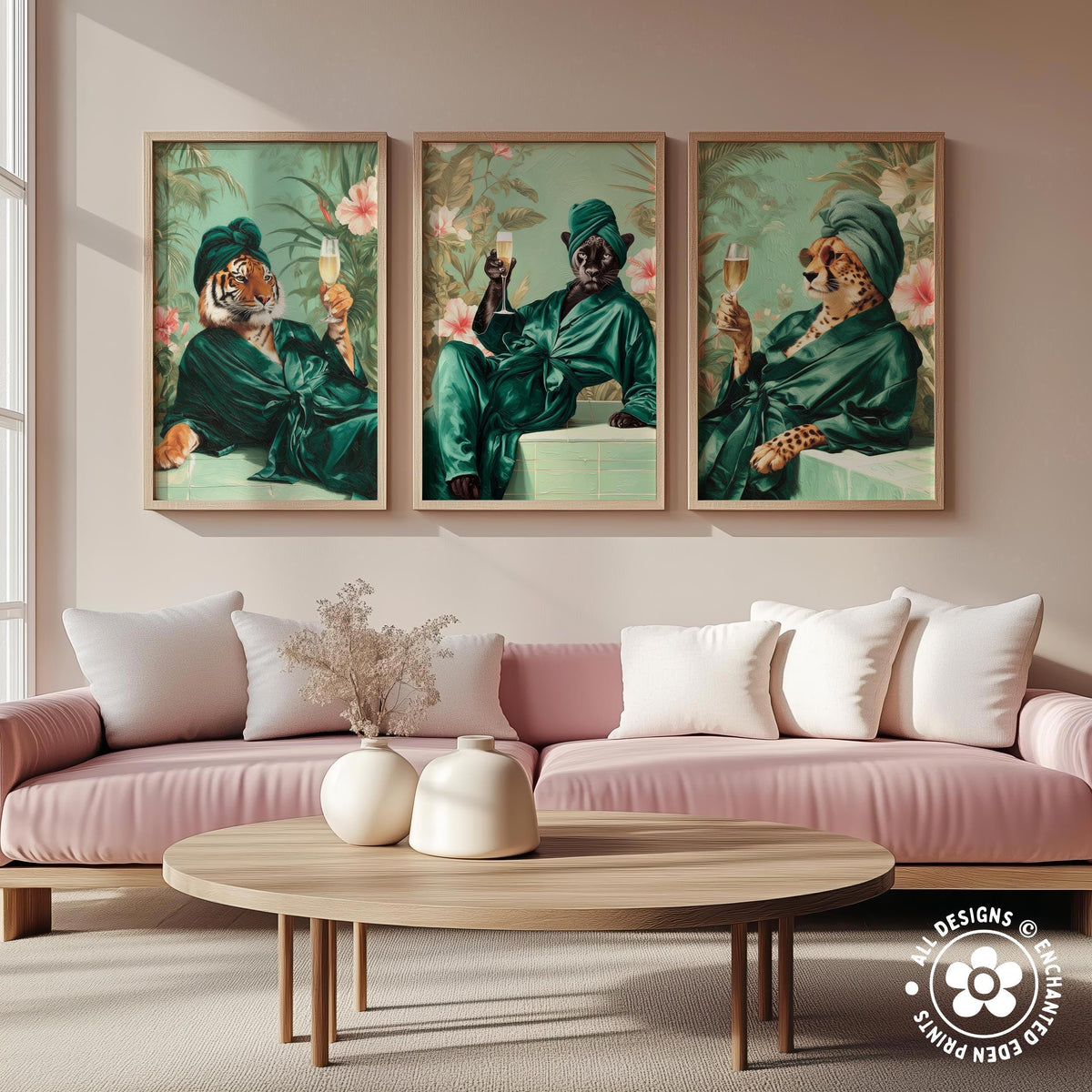 a living room with a pink sofa and a wooden coffee table. Above the sofa, there are three framed paintings depicting animals, including a tiger, a leopard, and a cheetah, all dressed in green and holding wine glasses.