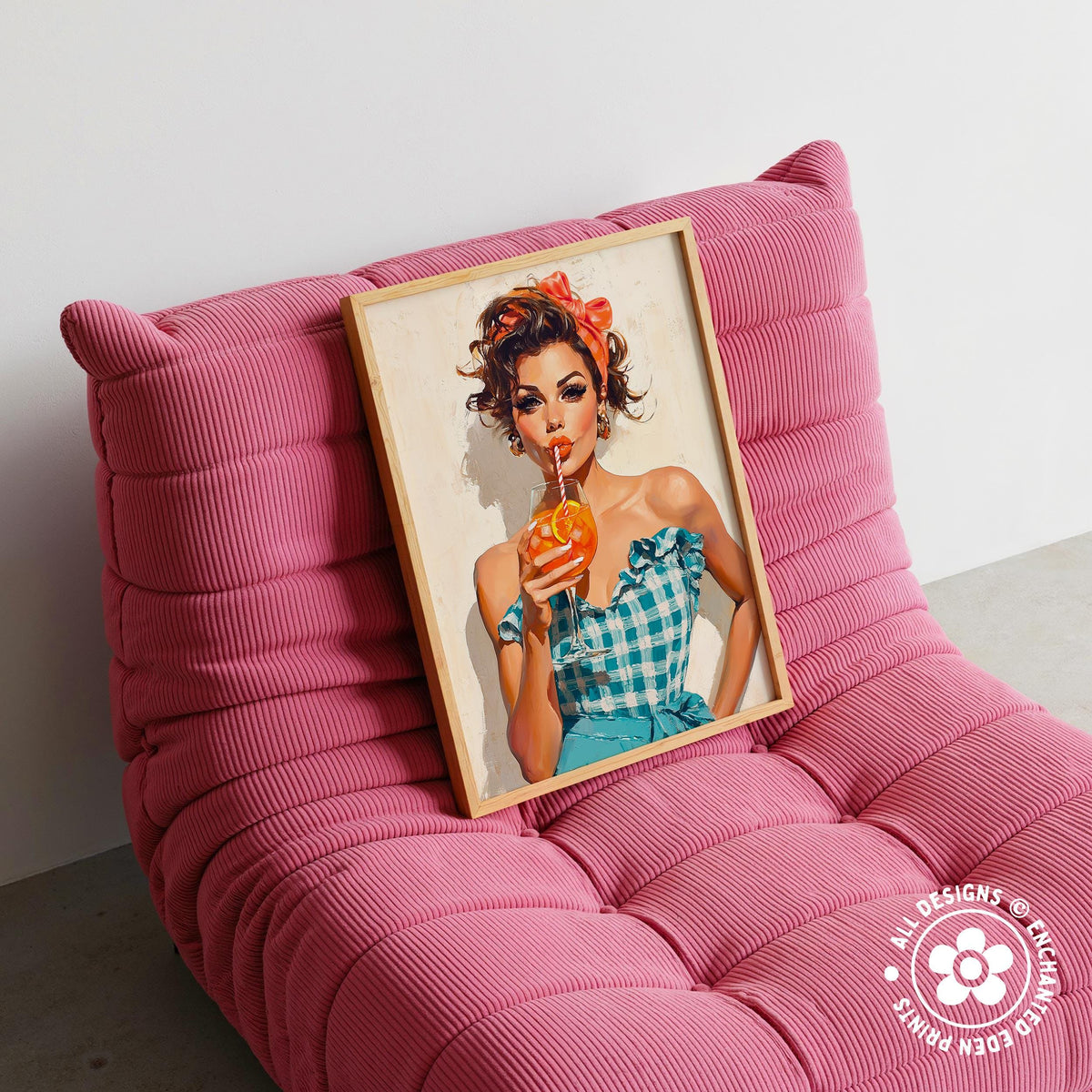 A framed illustration of a woman in a blue and white checkered dress holding an orange drink is displayed on a pink textured chair.