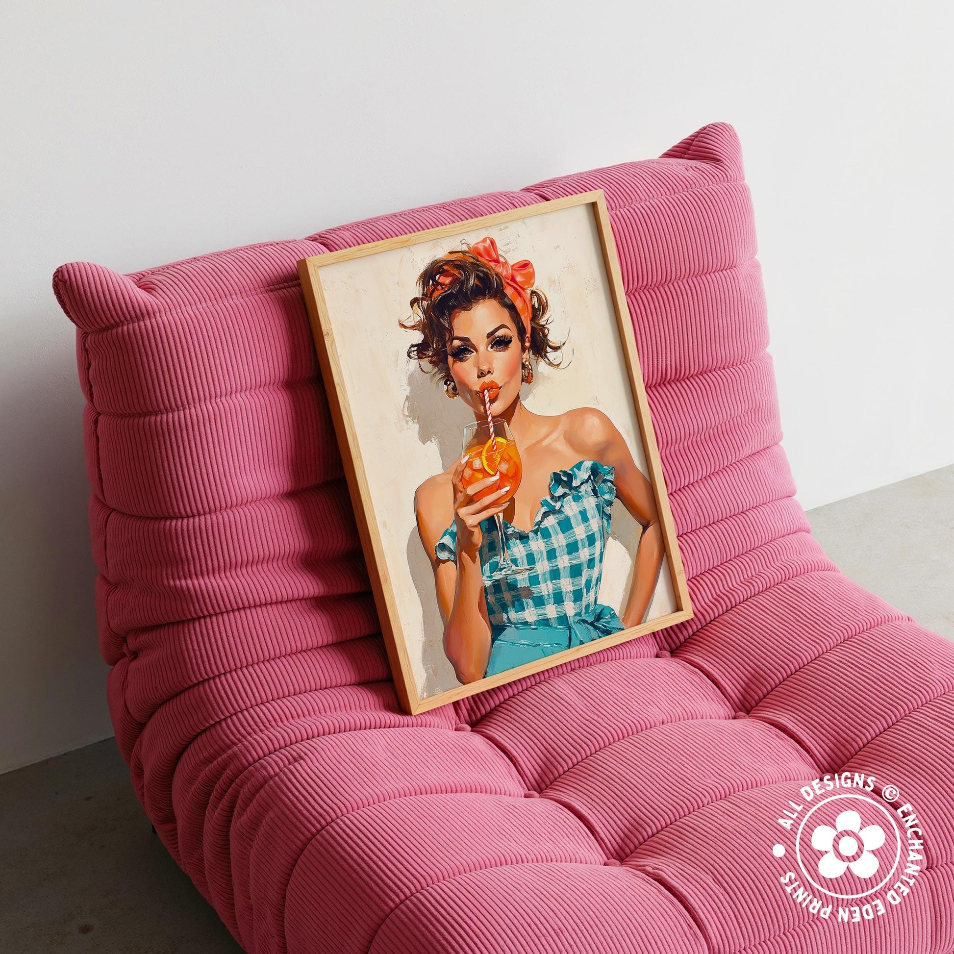 A framed illustration of a woman in a blue and white checkered dress holding an orange drink is displayed on a pink textured chair.