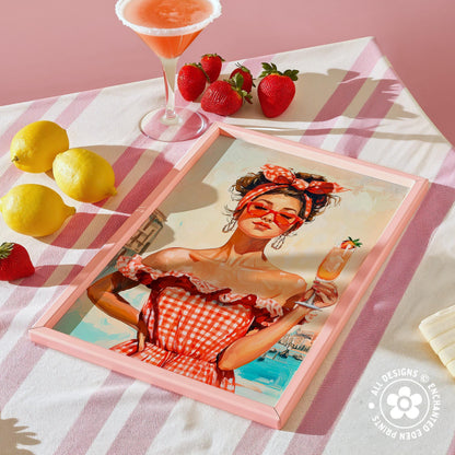 a framed painting of a woman in a red and white checkered dress, holding a drink, surrounded by a pink and white striped tablecloth, lemons, strawberries, and a cocktail glass.