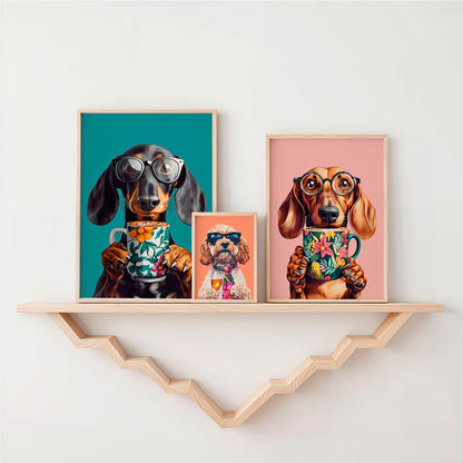 three framed pictures of dogs on a shelf