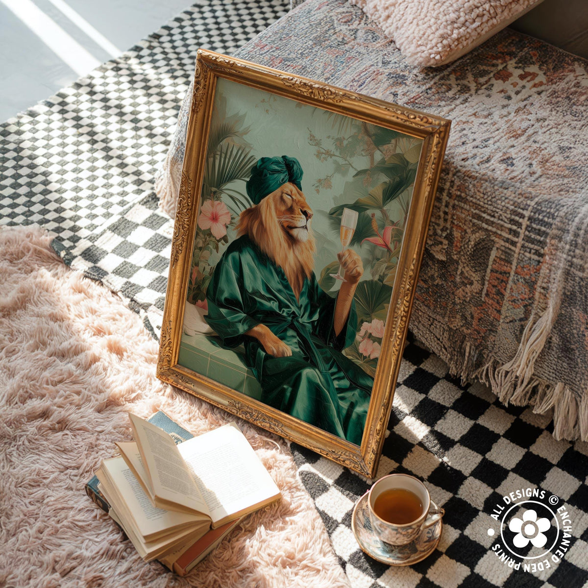 a framed painting of a lion wearing a green robe and holding a glass of wine, sitting on a rug next to a stack of books and a cup of tea.