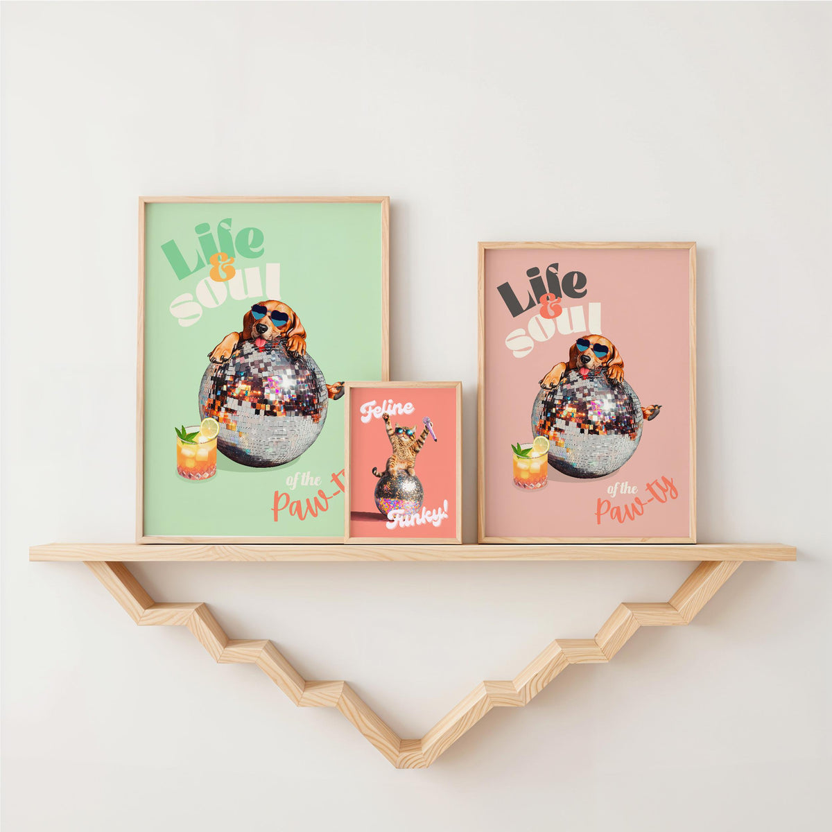 a couple of framed pictures on a shelf