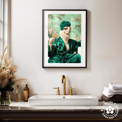 a framed picture of a person wearing a green robe and holding a glass of wine, hanging on a wall above a white sink with gold faucets.