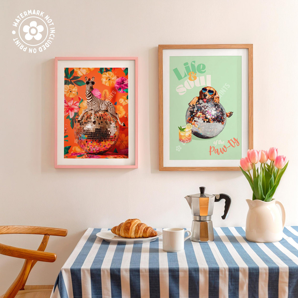 a table topped with a plate of food next to two framed pictures