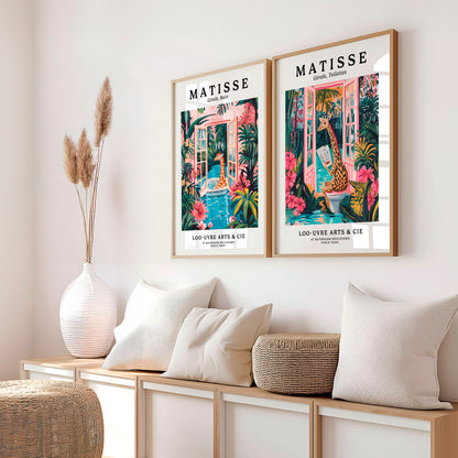 a couple of pictures hanging on the side of a wall