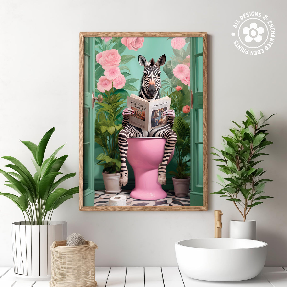 The image is a framed artwork depicting a zebra sitting on a pink toilet and reading a book, surrounded by pink flowers and green plants.