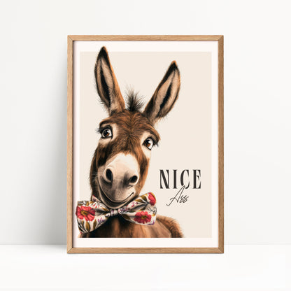 A donkey wearing a bow tie and smiling at the camera.