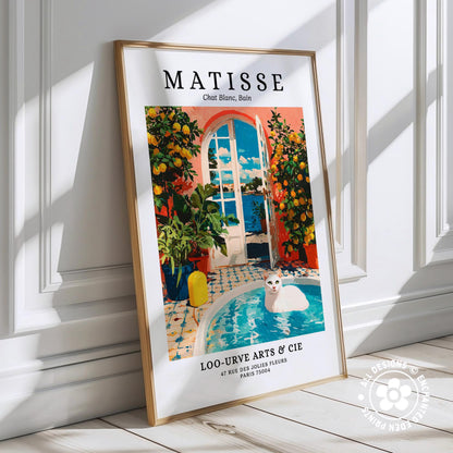 The image is a framed poster featuring an illustration of a cat sitting in a pool surrounded by a colorful garden scene.