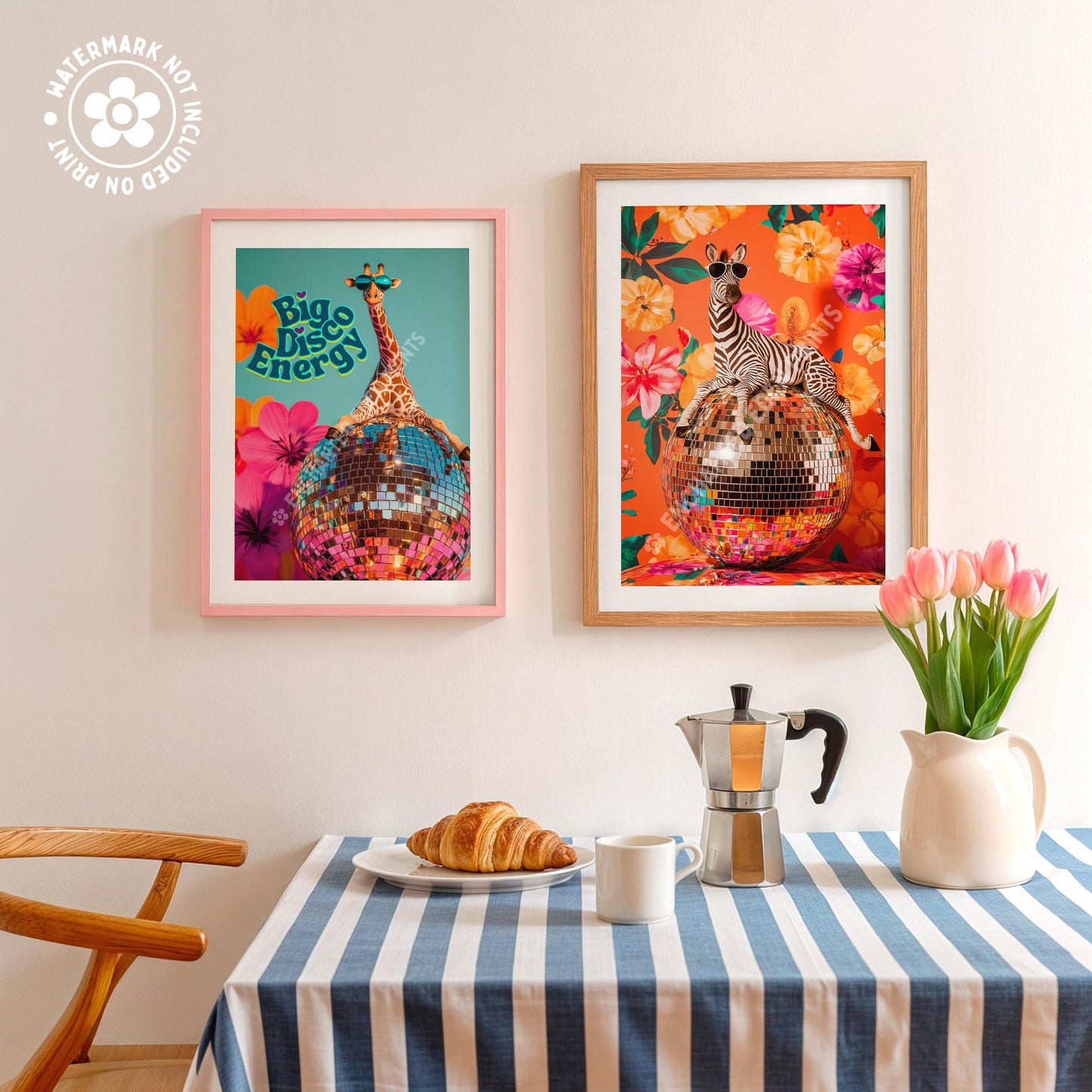 a table topped with a plate of food next to two framed pictures