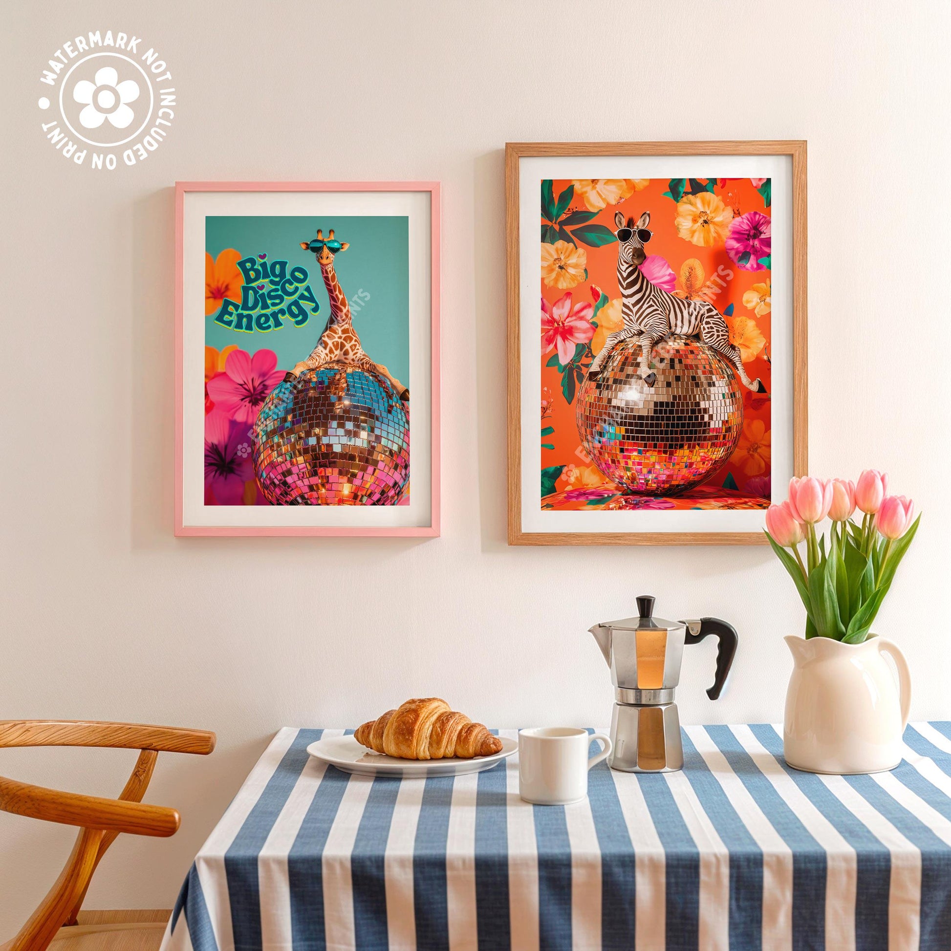 a table topped with a plate of food next to two framed pictures