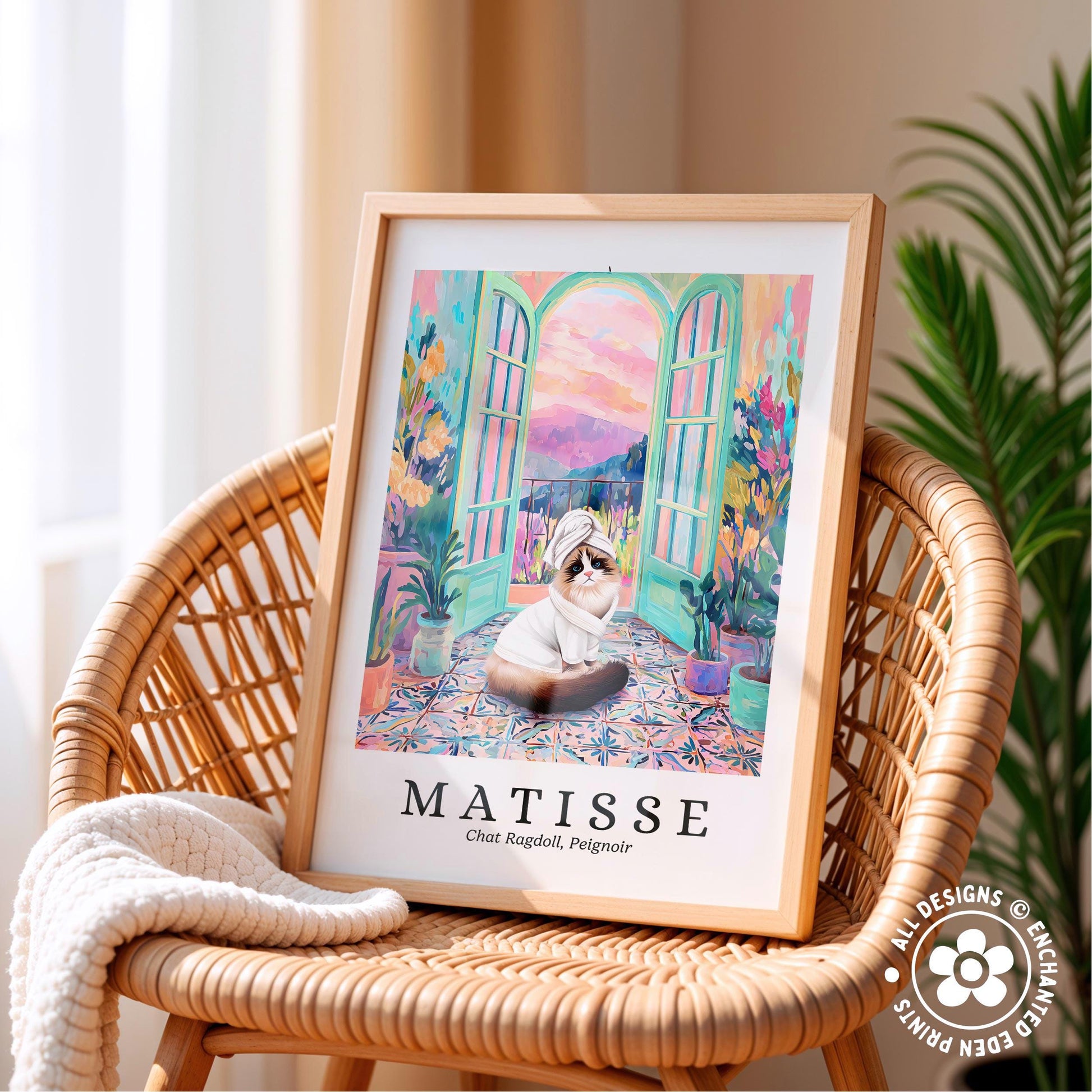 A framed painting of a cat sitting on a colorful rug, with a window and plants in the background, is displayed on a wicker chair.