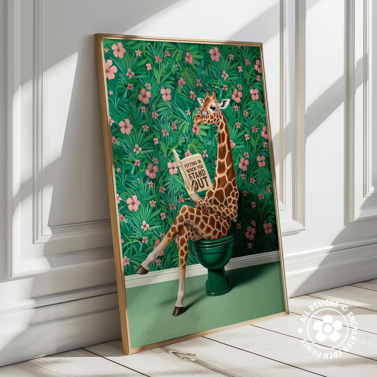 A giraffe sitting on a green toilet in a tropical setting with pink flowers and green foliage.