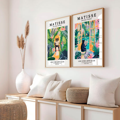 a couple of posters on a wall above a bench