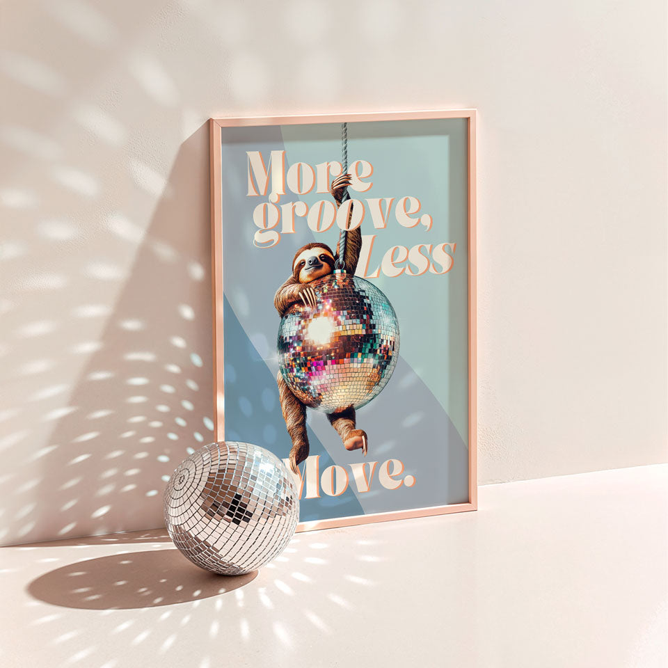 a disco ball sitting next to a poster on a wall
