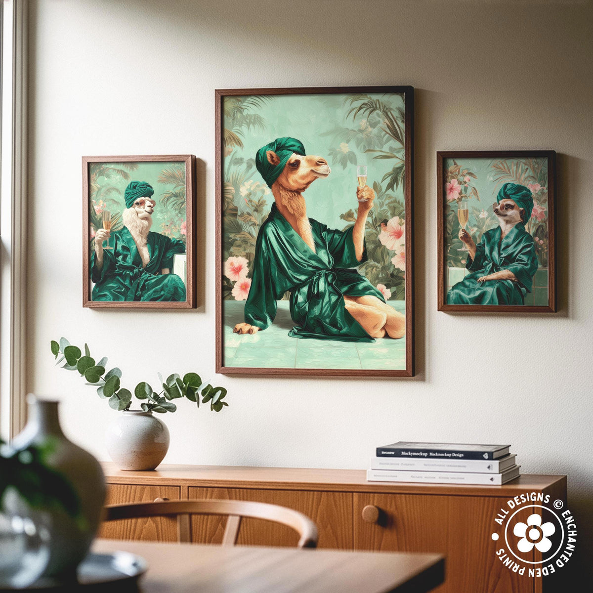 a wooden cabinet with a vase of greenery and a stack of books on top. Above the cabinet, there are three framed paintings depicting people in green robes, with one person holding a drink.