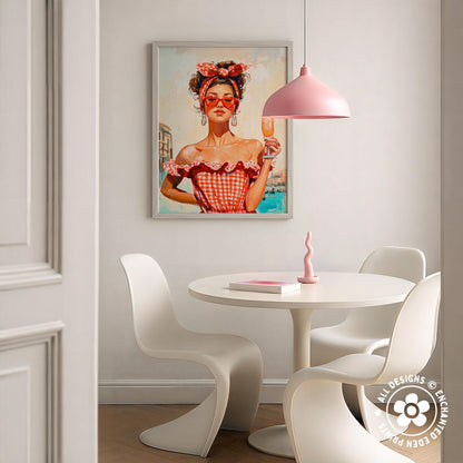 a dining area with a white table and chairs, a framed painting of a woman in a red and white checkered dress, and a pink pendant light hanging above the table.