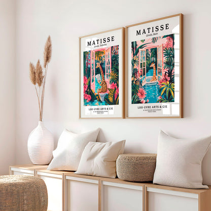 a couple of pictures hanging on the side of a wall