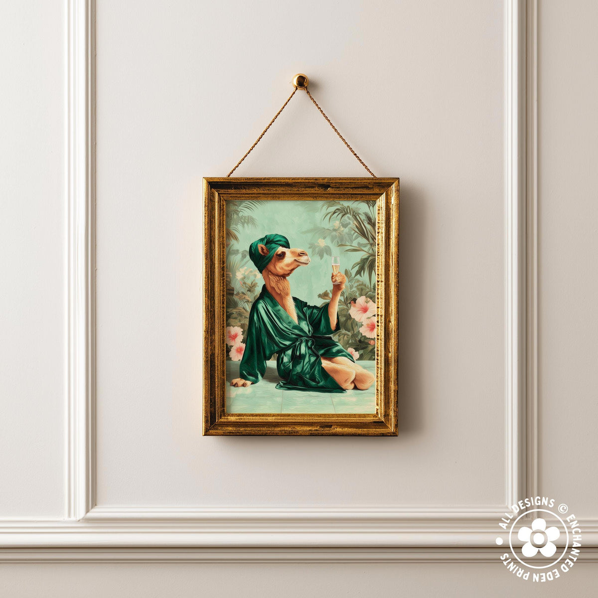 a framed painting of a camel wearing a green robe and hat, sitting on a bed with pink flowers in the background.